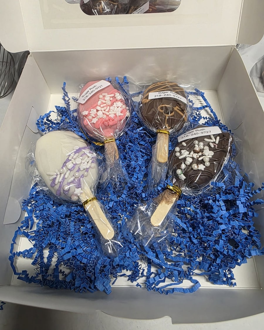 Assorted gift box with pink, white, caramel-drizzled, and dark chocolate cakesicles